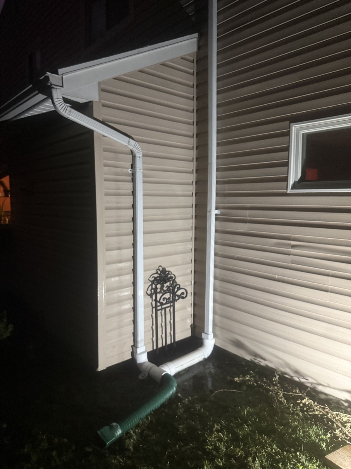 Finished exterior downspout drainage connection